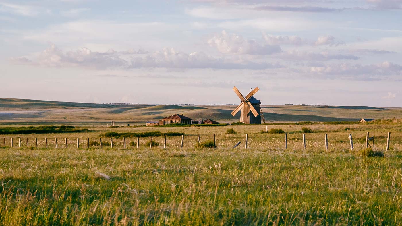 Windmill in isolated field Adobe Stock